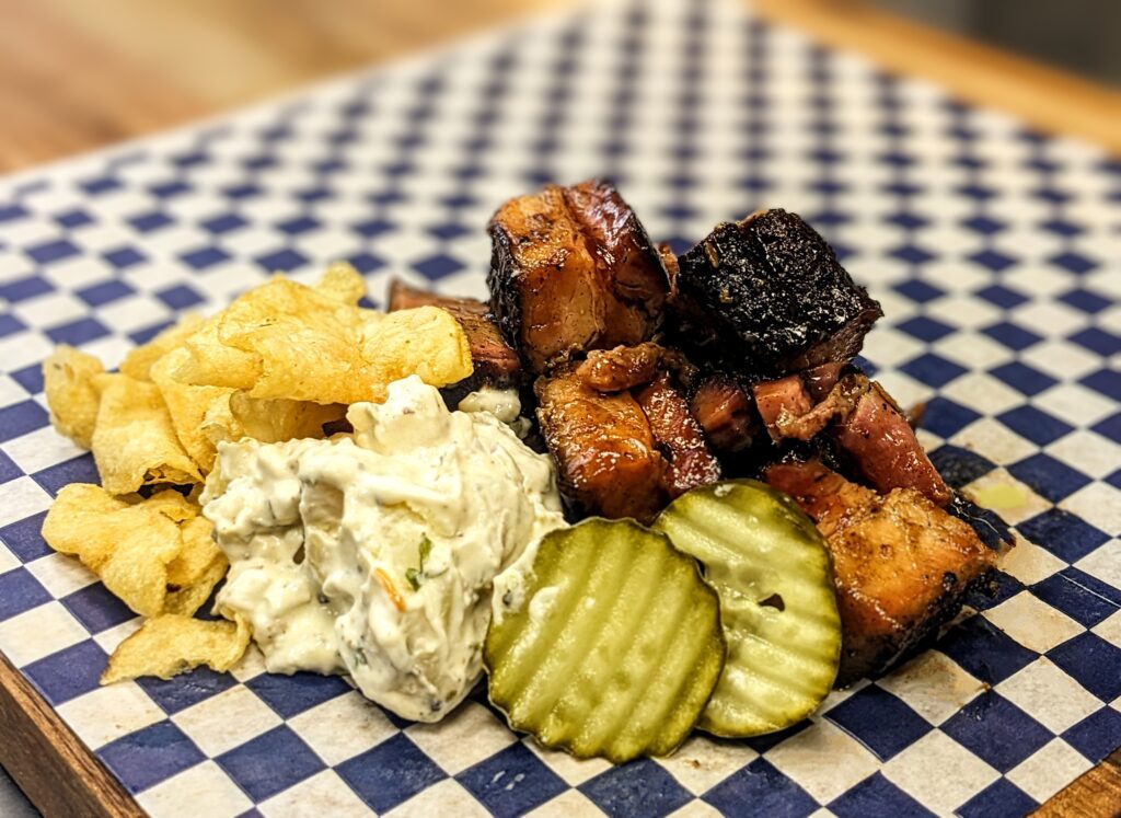 Pork Belly Burnt Ends with potato salad and chips